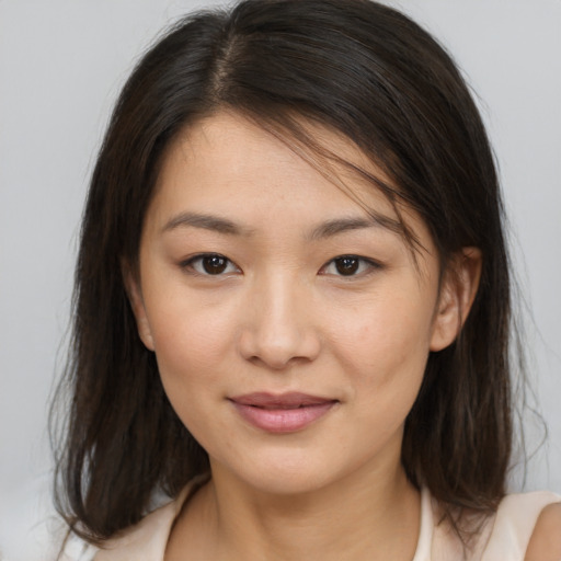 Joyful white young-adult female with medium  brown hair and brown eyes