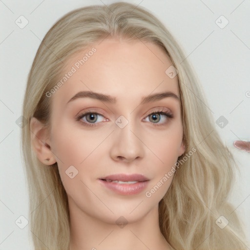 Joyful white young-adult female with long  brown hair and blue eyes