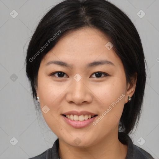 Joyful asian young-adult female with medium  brown hair and brown eyes