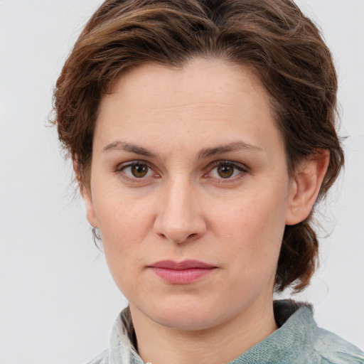 Joyful white young-adult female with medium  brown hair and green eyes