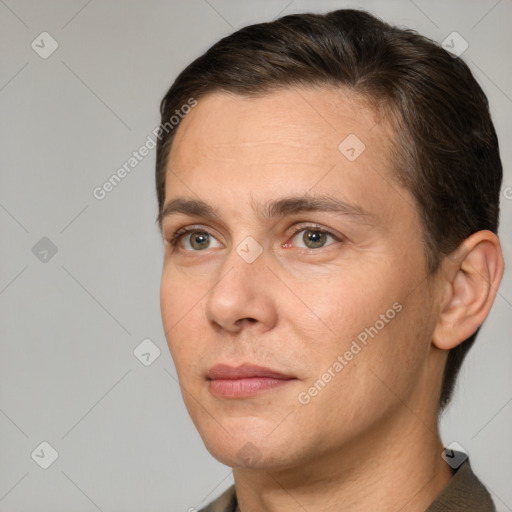 Joyful white adult male with short  brown hair and brown eyes