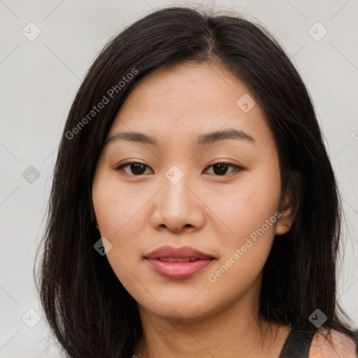 Joyful asian young-adult female with long  brown hair and brown eyes