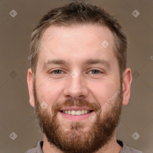 Joyful white adult male with short  brown hair and brown eyes