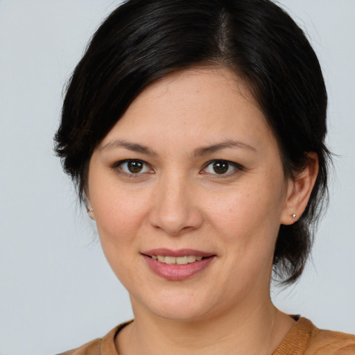 Joyful white young-adult female with medium  brown hair and brown eyes