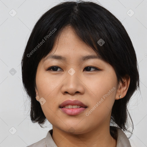 Joyful asian young-adult female with medium  black hair and brown eyes