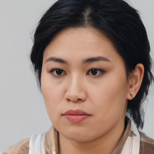 Neutral asian young-adult female with medium  brown hair and brown eyes