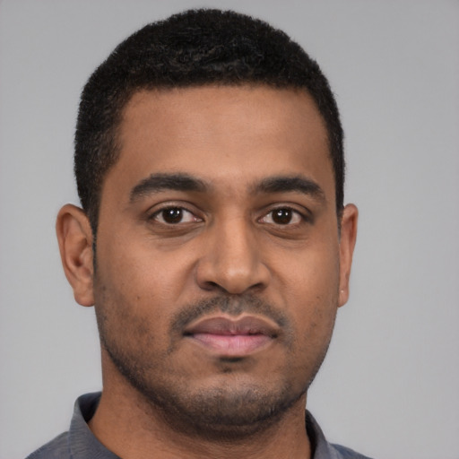 Neutral black young-adult male with short  black hair and brown eyes