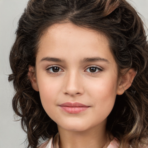 Joyful white child female with medium  brown hair and brown eyes