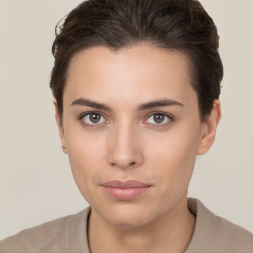 Neutral white young-adult female with short  brown hair and brown eyes