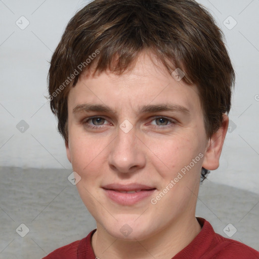 Joyful white young-adult female with short  brown hair and grey eyes