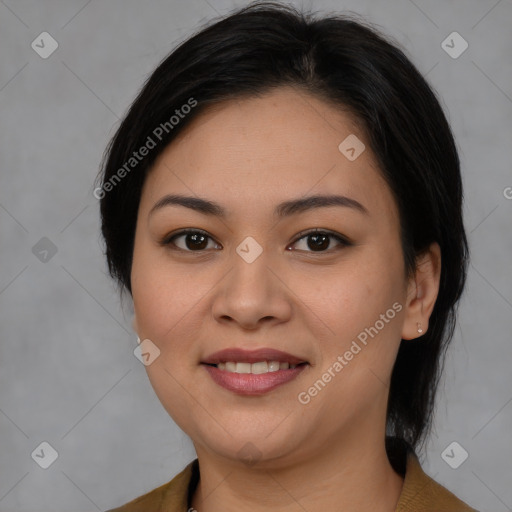 Joyful latino young-adult female with medium  brown hair and brown eyes