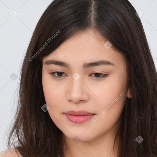 Joyful asian young-adult female with long  brown hair and brown eyes