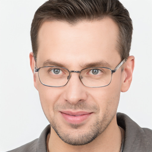 Joyful white adult male with short  brown hair and brown eyes