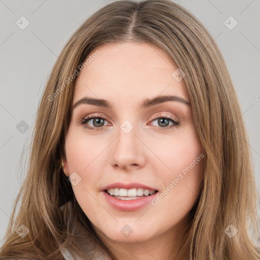 Joyful white young-adult female with long  brown hair and green eyes