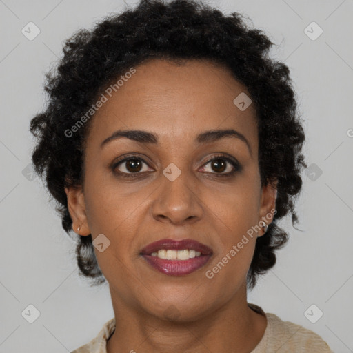 Joyful black adult female with short  brown hair and brown eyes