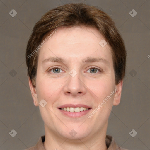 Joyful white adult female with short  brown hair and grey eyes