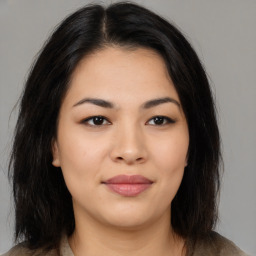 Joyful asian young-adult female with medium  black hair and brown eyes