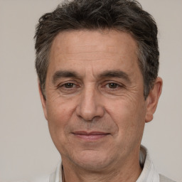 Joyful white middle-aged male with short  brown hair and brown eyes