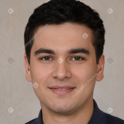 Joyful white young-adult male with short  black hair and brown eyes