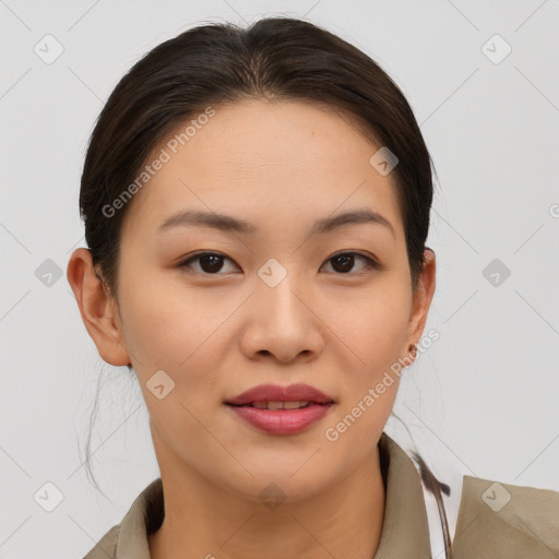 Joyful asian young-adult female with short  brown hair and brown eyes