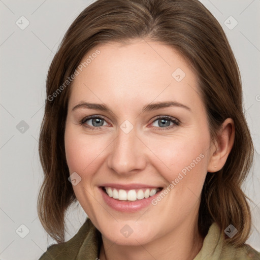 Joyful white young-adult female with medium  brown hair and grey eyes