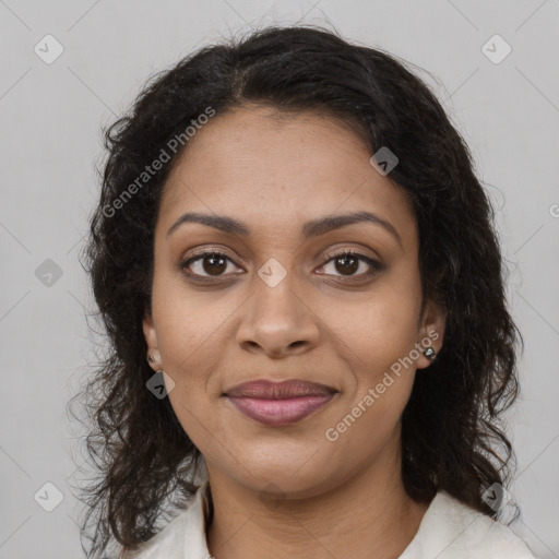 Joyful black young-adult female with medium  brown hair and brown eyes