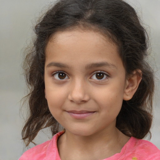 Joyful white child female with medium  brown hair and brown eyes