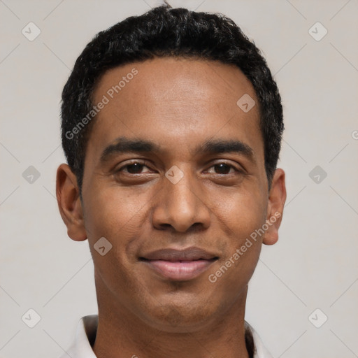 Joyful black young-adult male with short  black hair and brown eyes