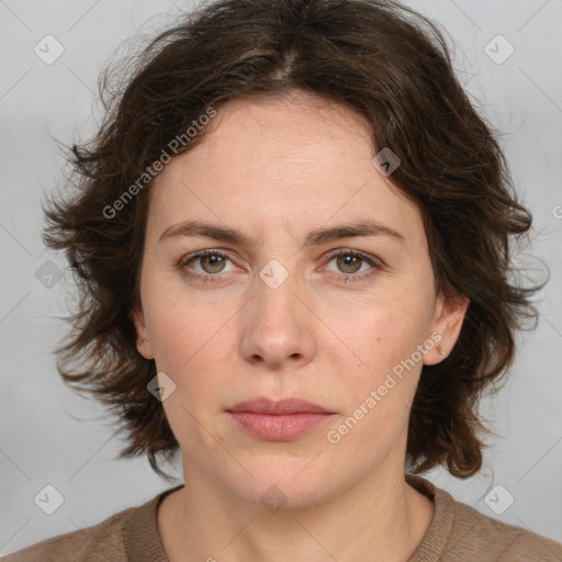 Joyful white young-adult female with medium  brown hair and green eyes