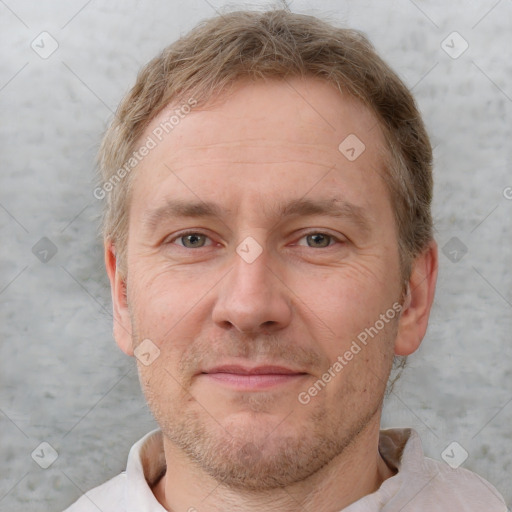 Joyful white adult male with short  brown hair and grey eyes