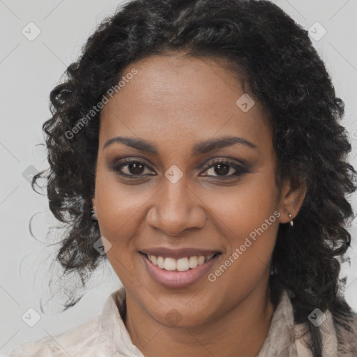 Joyful black young-adult female with long  brown hair and brown eyes