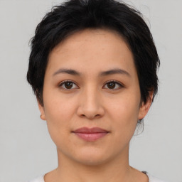 Joyful asian young-adult female with short  black hair and brown eyes