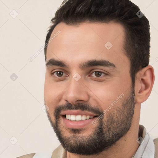 Joyful white young-adult male with short  black hair and brown eyes