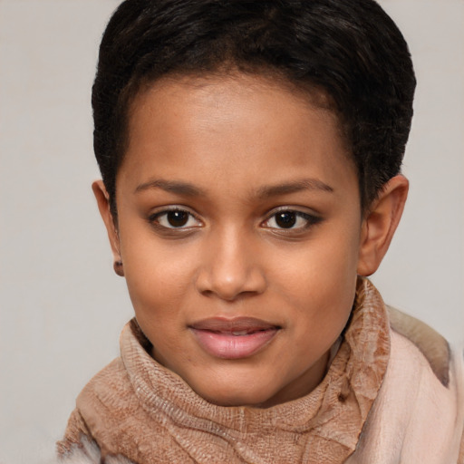 Joyful black child female with short  brown hair and brown eyes