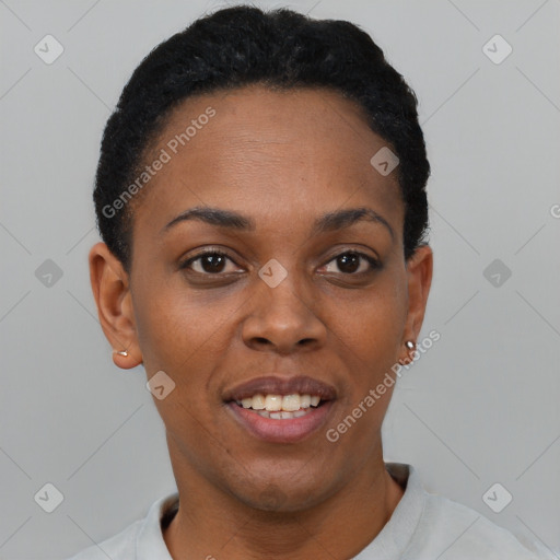 Joyful black young-adult female with short  black hair and brown eyes