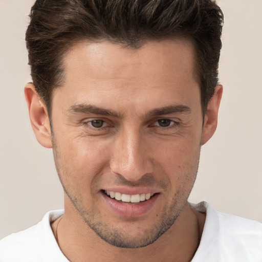 Joyful white young-adult male with short  brown hair and brown eyes