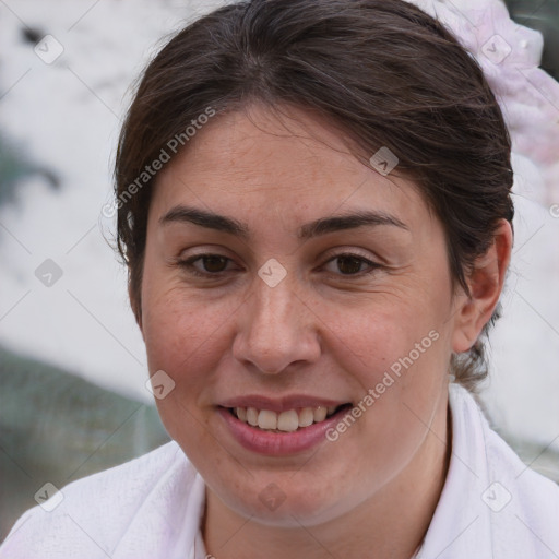 Joyful white adult female with medium  brown hair and brown eyes