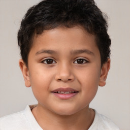 Joyful white child male with short  brown hair and brown eyes