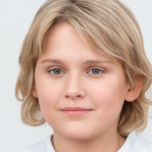 Joyful white child female with medium  brown hair and grey eyes