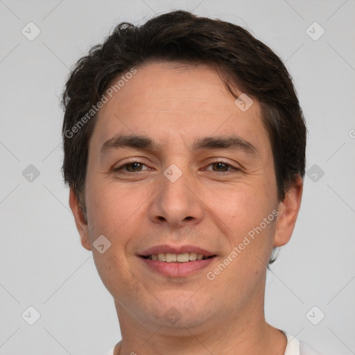 Joyful white adult male with short  brown hair and brown eyes