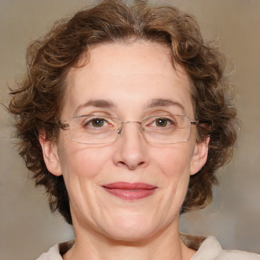 Joyful white middle-aged female with medium  brown hair and brown eyes