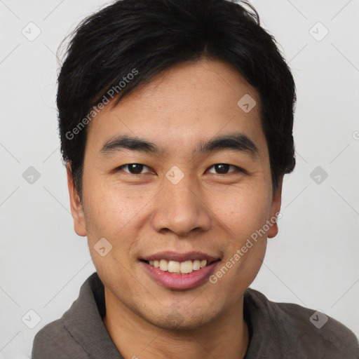 Joyful asian young-adult male with short  black hair and brown eyes