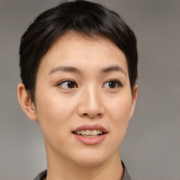 Joyful asian young-adult female with short  brown hair and brown eyes
