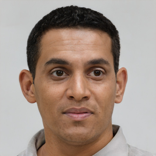 Neutral black young-adult male with short  black hair and brown eyes