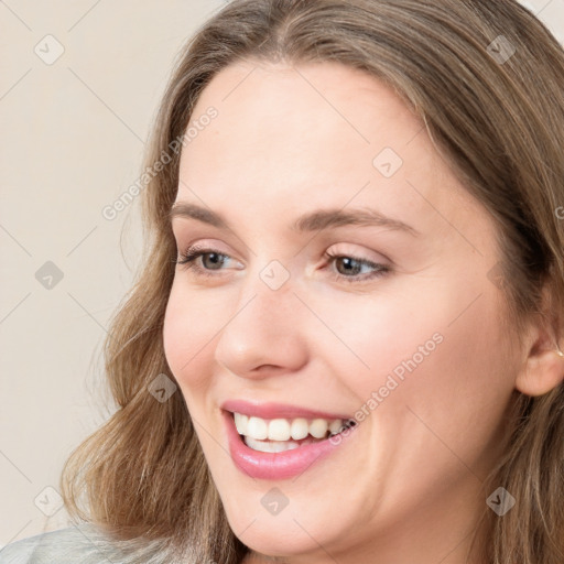 Joyful white young-adult female with long  brown hair and grey eyes