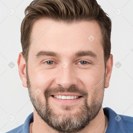 Joyful white young-adult male with short  brown hair and brown eyes