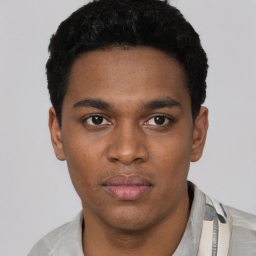 Neutral black young-adult male with short  black hair and brown eyes