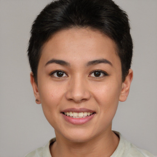 Joyful asian young-adult female with short  brown hair and brown eyes