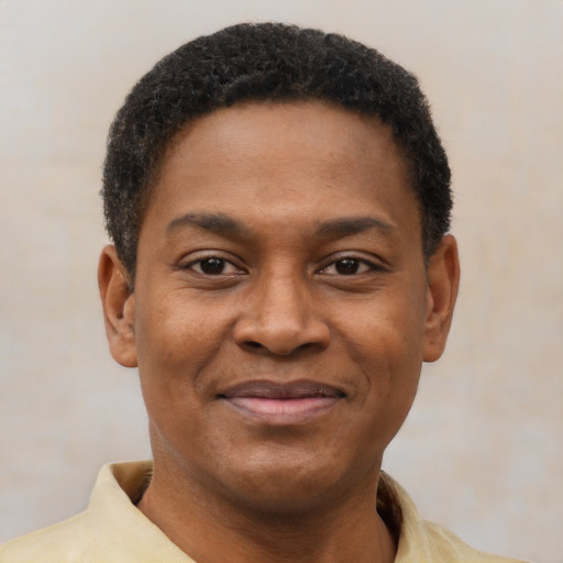 Joyful latino young-adult male with short  brown hair and brown eyes