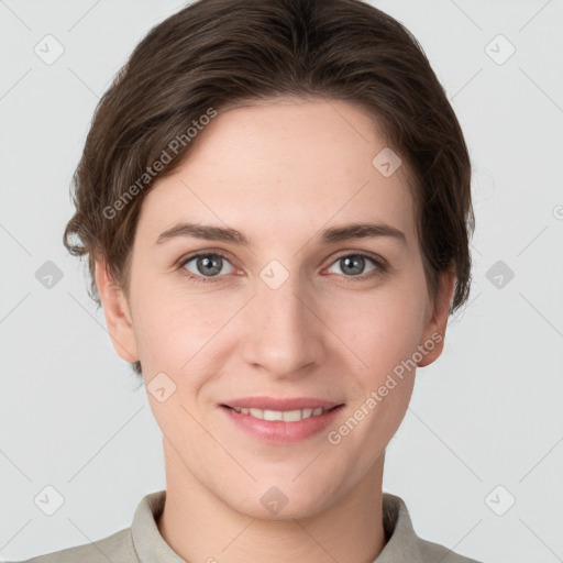 Joyful white young-adult female with short  brown hair and grey eyes